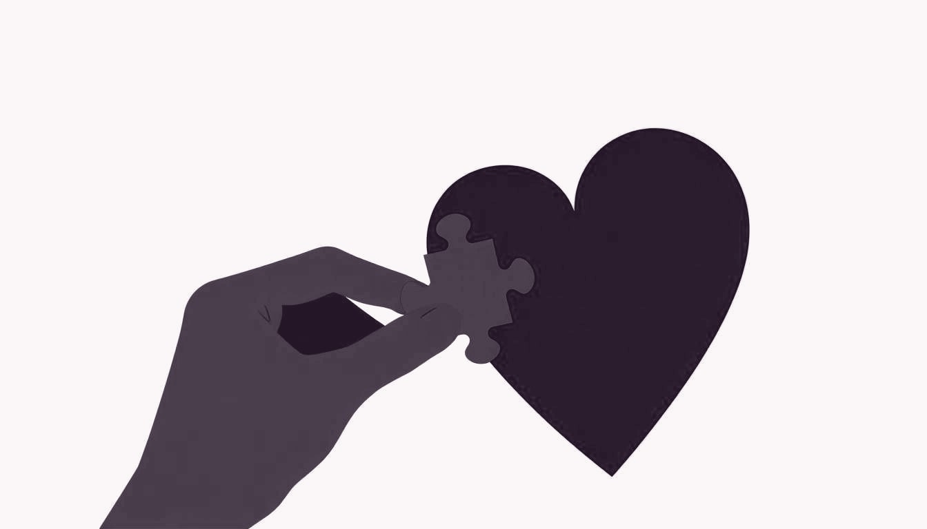 A single heart-shaped puzzle piece being gently fitted into a larger heart